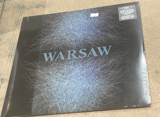 The front of Warsaw’s self-titled album on vinyl. 